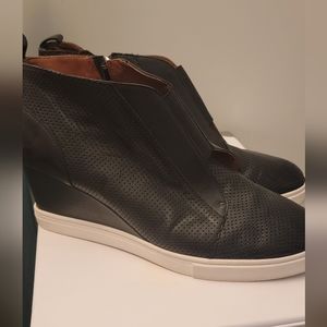 Genuine leather wedge sneaker.